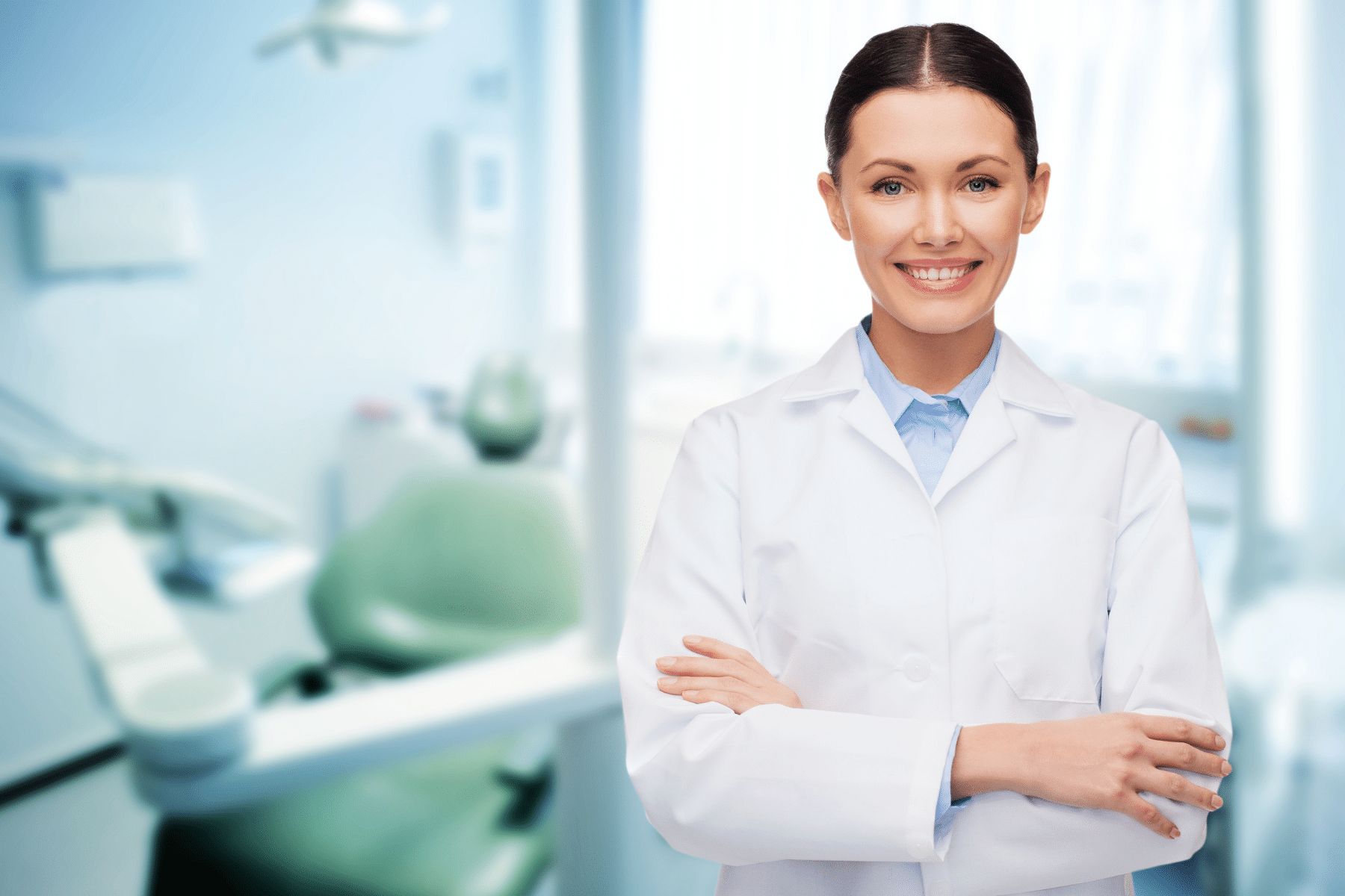 Female dentist with her arms crossed