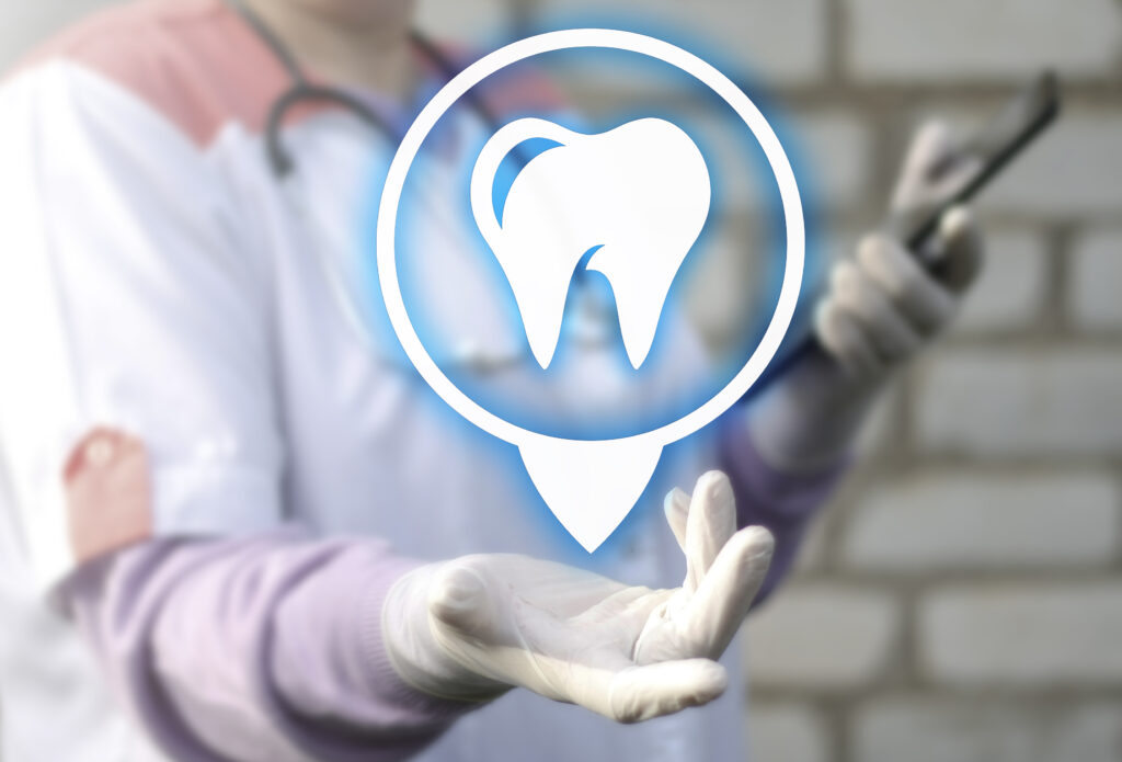 digital tooth in a circle in a professional's hand
